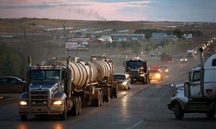 Traffic generated by an oil boom lines the main street in Watford City, North Dakota